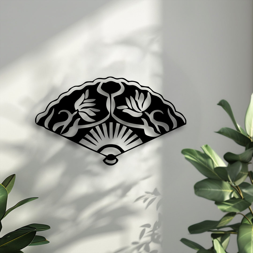 The dynamic transition between the black metal and white negative space defines this unique Oriental Folding Fan decorative metal art.
