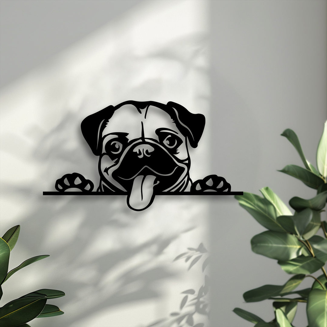 A cute, playful pug dog decorative metal art silhouette peeks over a ledge with its tongue out and paws visible, casting a shadow.