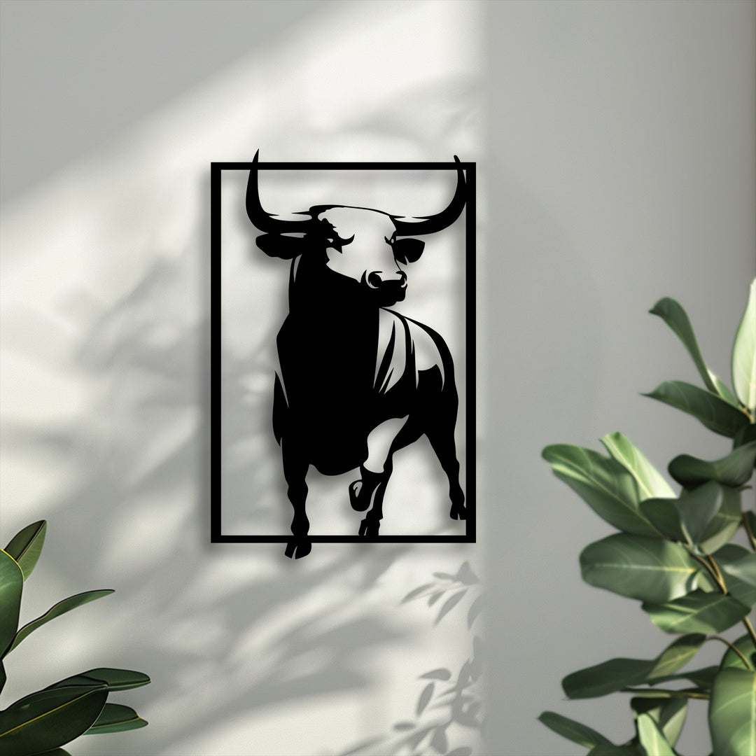 A striking monochromatic decorative metal art piece showcasing a powerful black bull silhouette framed against a light grey background.