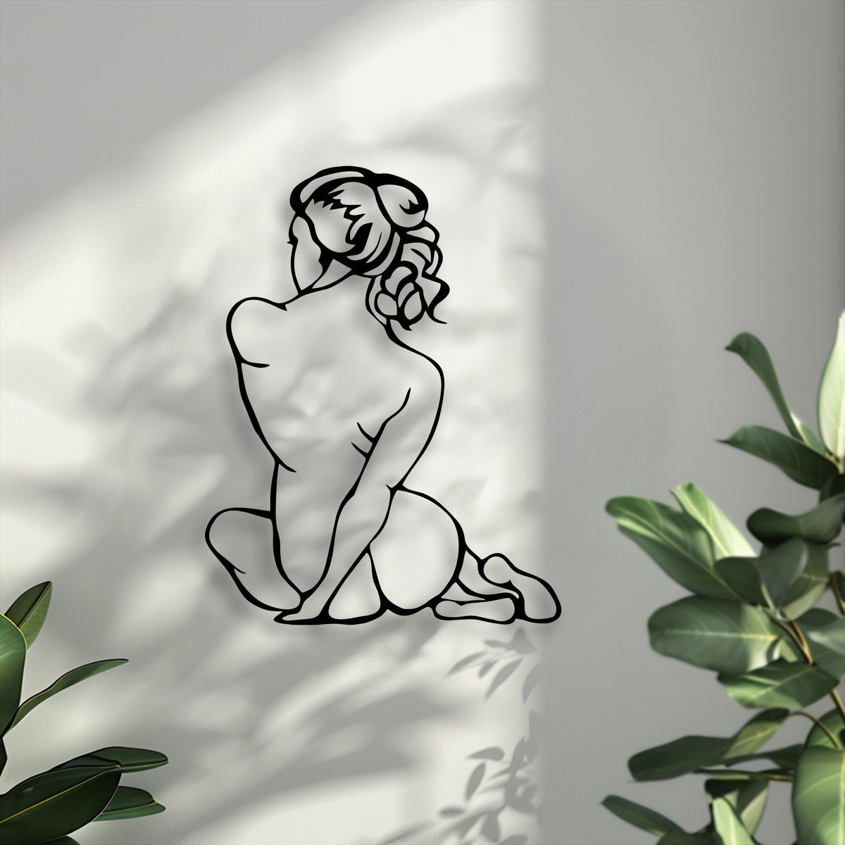 Minimalist female figure metal wall art in a modern interior