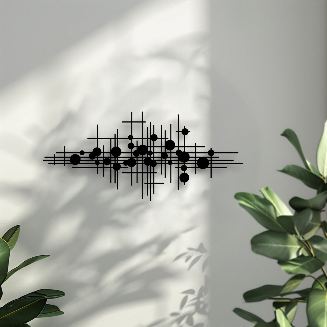Dramatic light and shadow intricately play across the bold geometric lines metal artwork, emphasizing its abstract modern design.