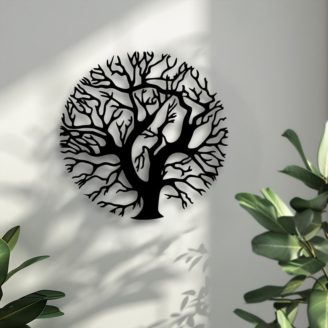 Soft white wall showcases intricate Tree of Life metal artwork, a round nature silhouette decor piece, creating beautiful shadows.