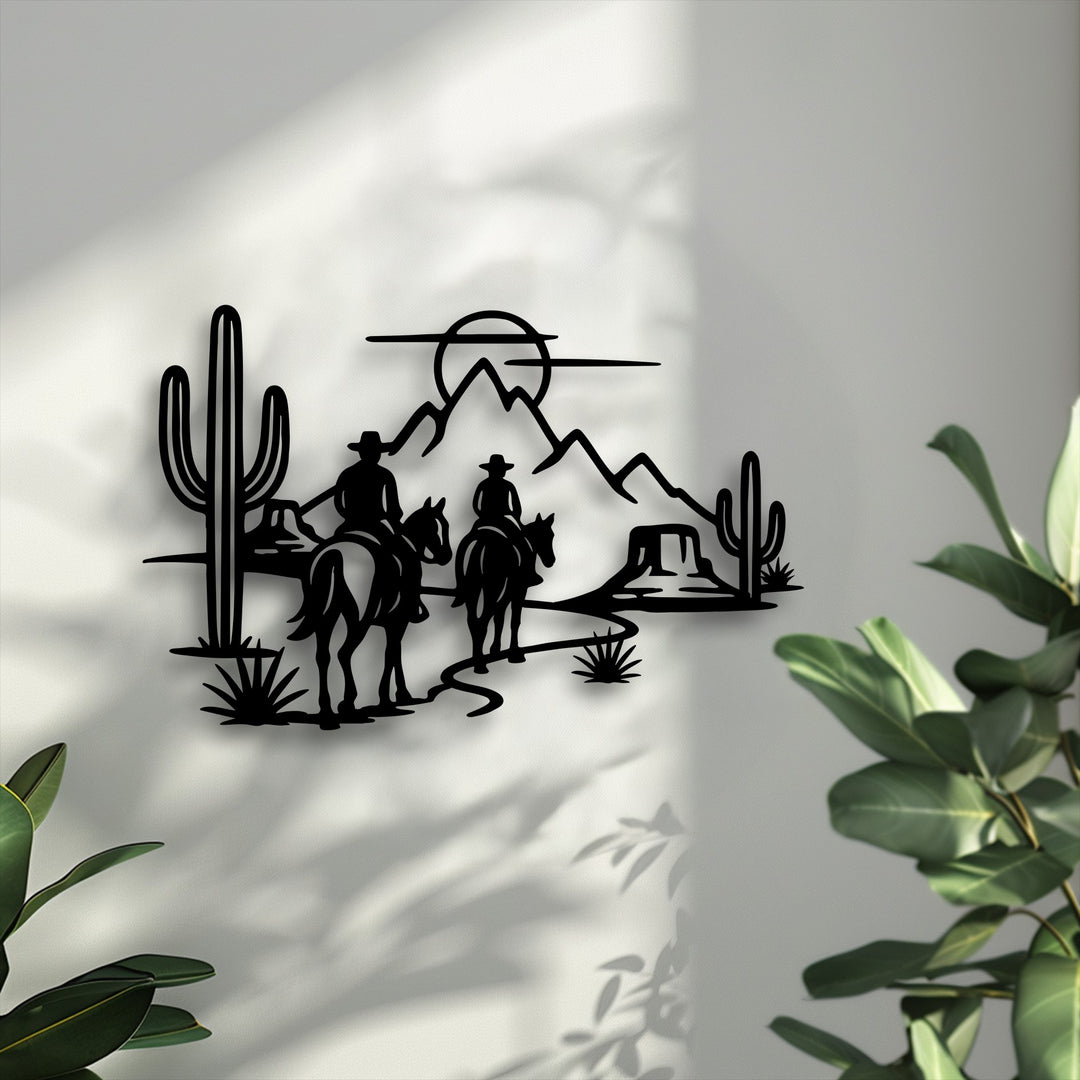 Organic forms of desert cacti, majestic mountains, and two cowboys on horseback create stunning Western metal art for wall decor.
