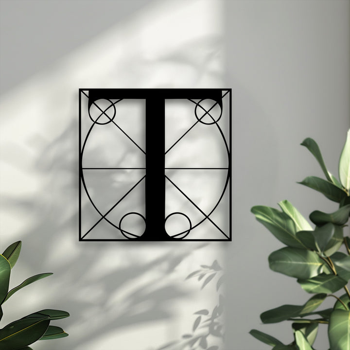 The sleek matte black finish of the geometric Letter T metal wall art offers modern decoration wall art with a striking line design.