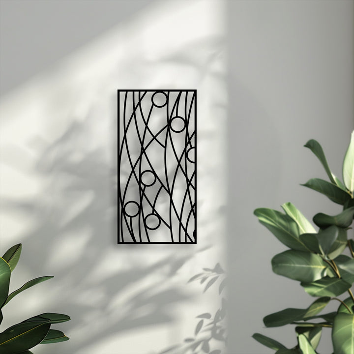 Crisp, neutral-to-cool color temperature illuminates an abstract linear geometry metal artwork with modern minimalist design.