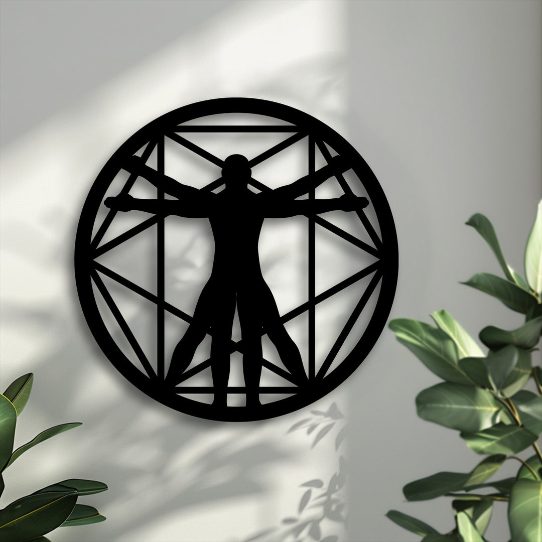 A prominent black Vitruvian Man geometric circle metal art for wall, inspired by Renaissance design, casts elegant shadows on a light wall.