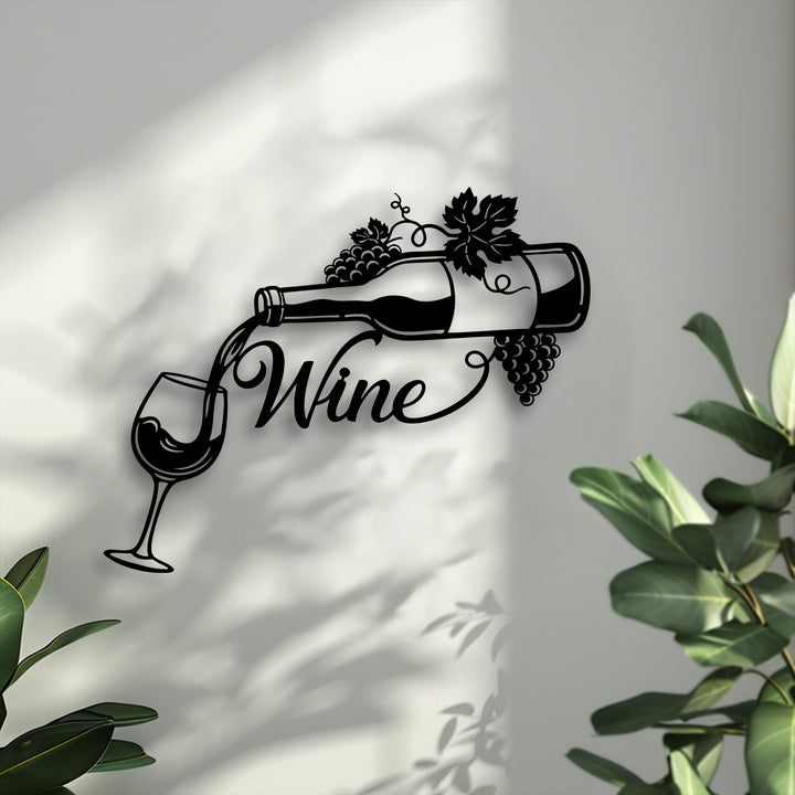 The negative space around the elegant black metal wall decor of a pouring wine bottle and glass creates striking shadows on a textured white surface.