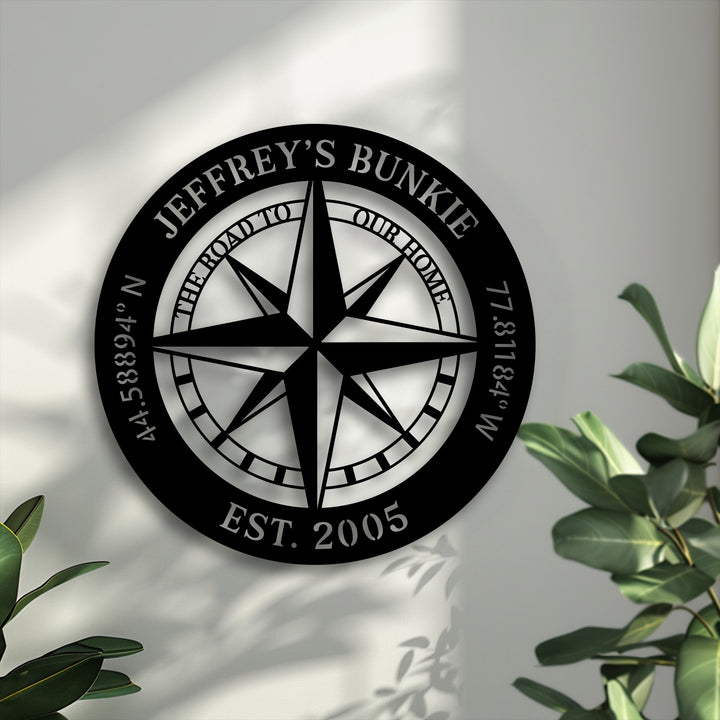 The sleek matte black finish of the personalized compass decorative metal art creates a striking silhouette on the wall.