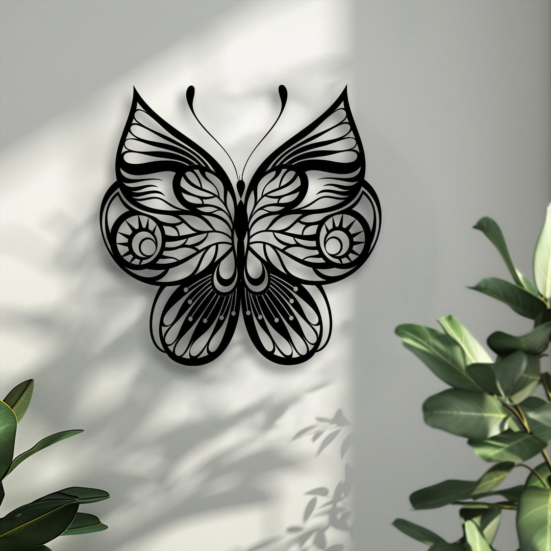 The realistic detail of this ornate butterfly unique metal wall art highlights intricate wing patterns, casting clear, textured shadows on the bright wall.