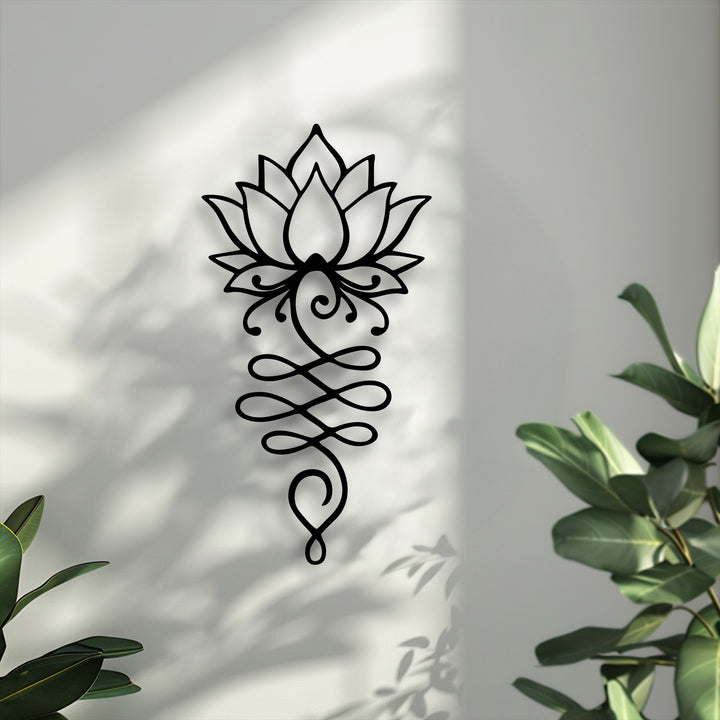 The radiant brightest area of the textured wall beautifully frames the intricate lotus flower decorative metal art.