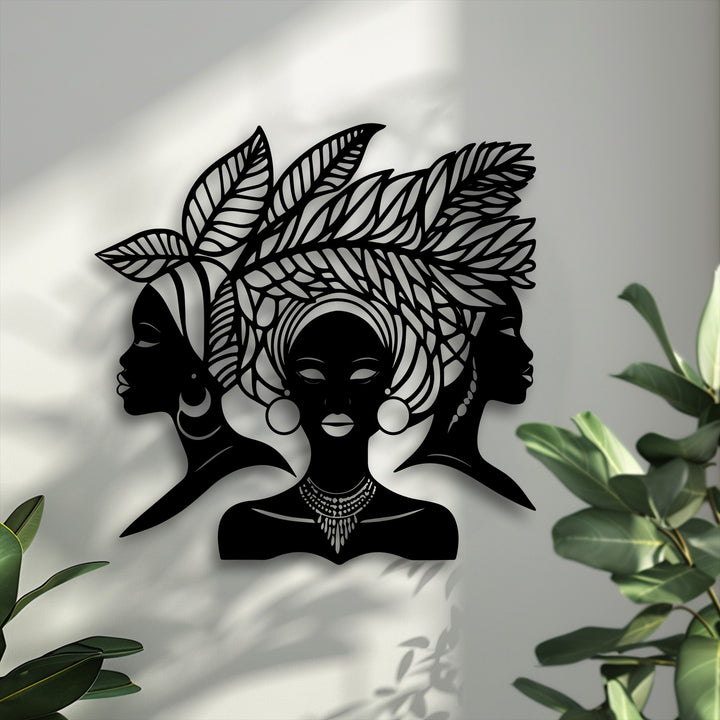 With high color saturation, this striking African Queen Silhouette metal wall decor showcases elegant black figures against a muted background.