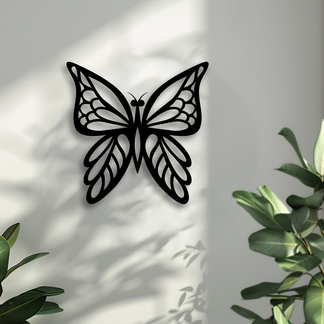 Black butterfly metal wall art with intricate wings is the focal point, casting shadows, a perfect decoration wall art.