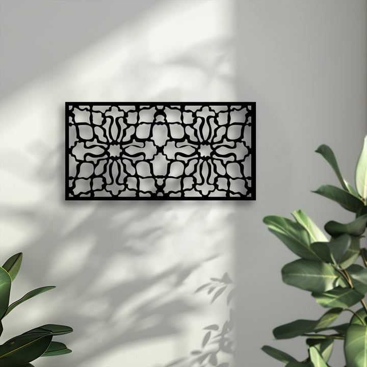 Horizontally oriented, this rectangular unique metal wall art showcases an ornamental geometric pattern panel, adding a decorative touch.