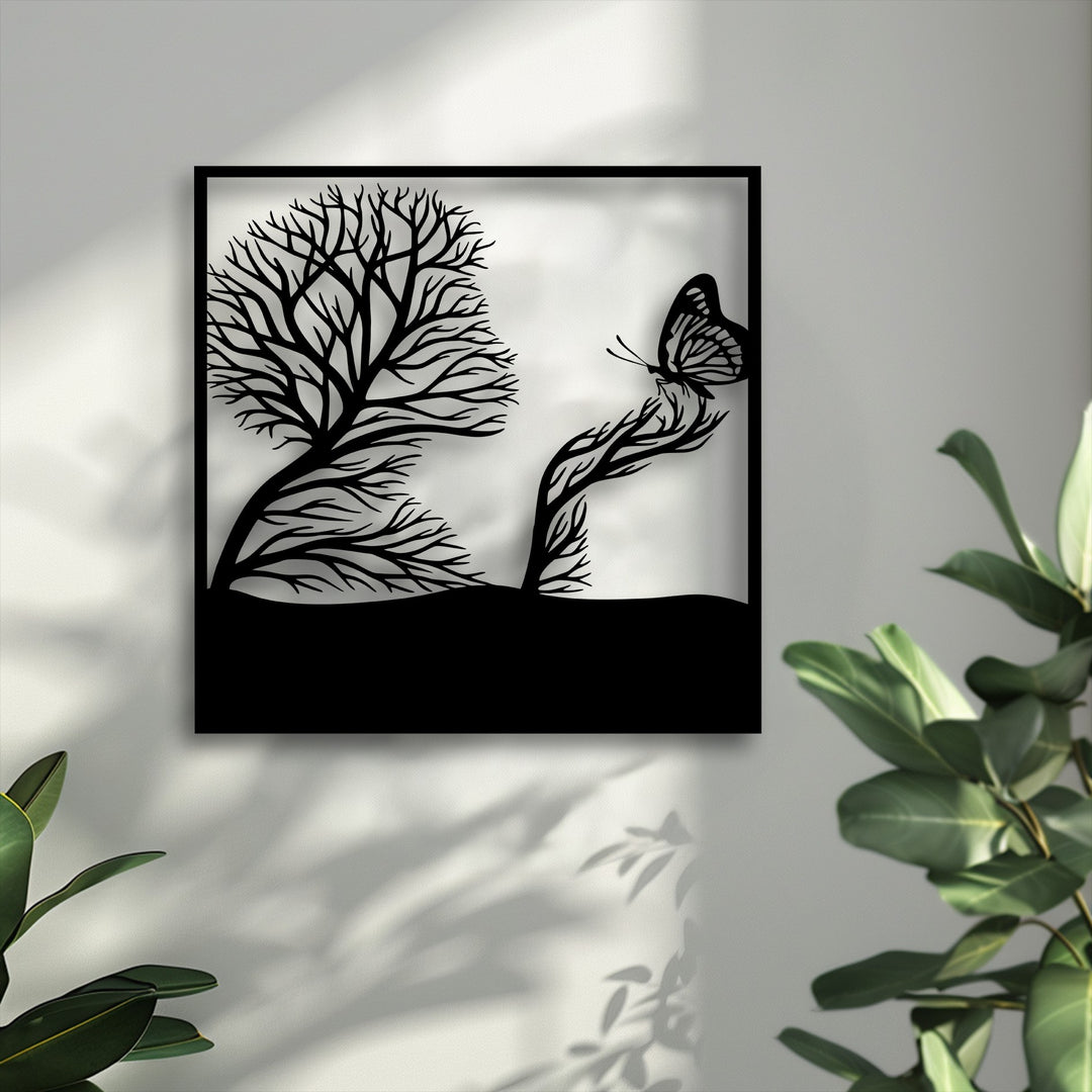 The bright background highlights the intricate black silhouette of the whimsical tree and butterfly decoration wall art.
