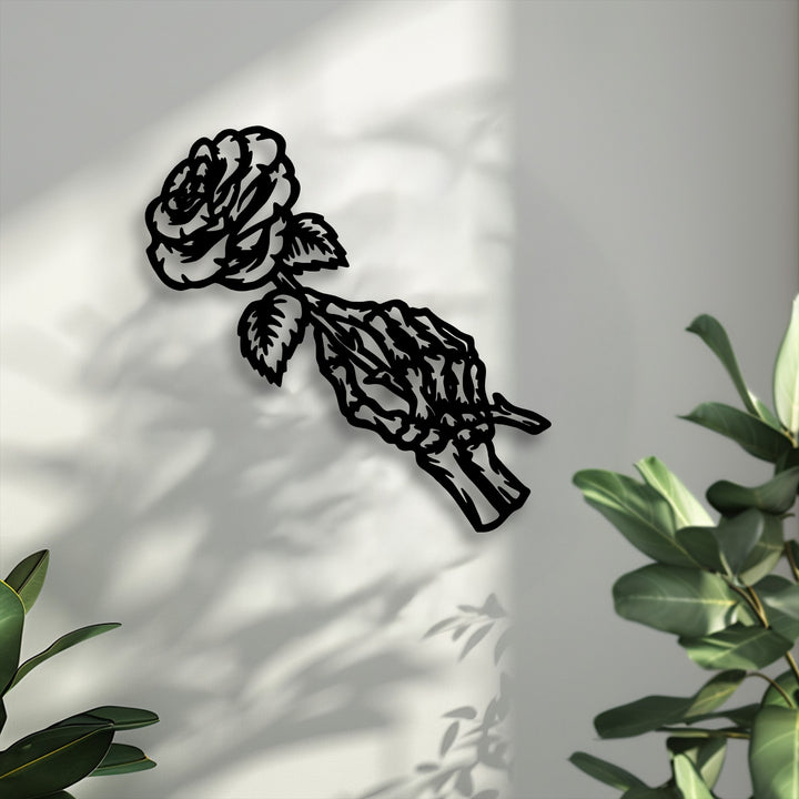 The serene unique metal wall art features a gothic rose skeleton, poised gracefully against a shadow-dappled wall.