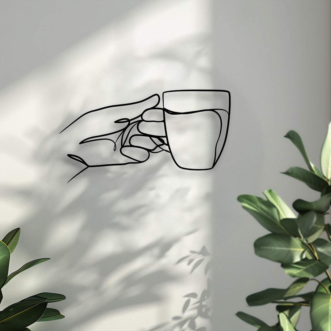 Experience the superior material quality of this unique metal wall art, displaying a minimalist line art hand holding a cup.