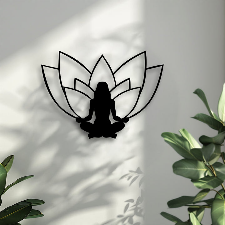 The prominent layering effect of the black lotus meditation metal artwork creates a distinct visual depth with its silhouette and strong wall shadows.