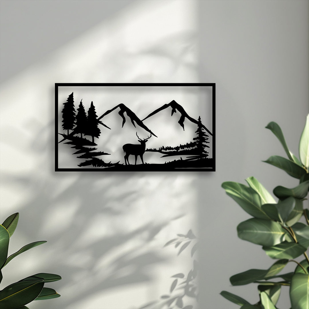A majestic deer silhouette, standing proudly among detailed mountains and pine trees, is featured in this elegant black metal art for wall.