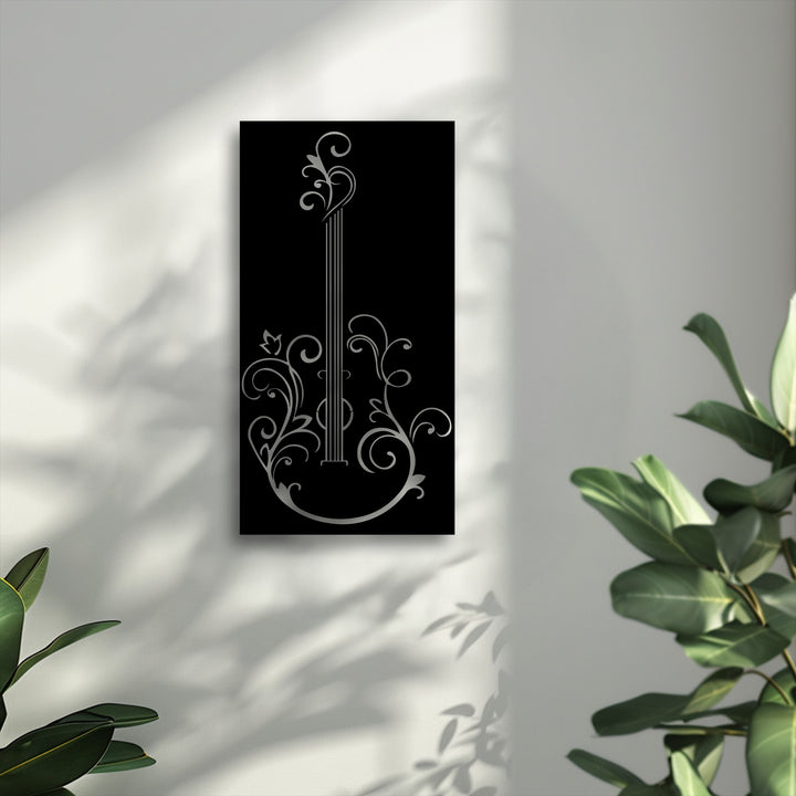 A vertically oriented, rectangular metal wall decor piece featuring an elegant guitar silhouette adorned with intricate floral designs.