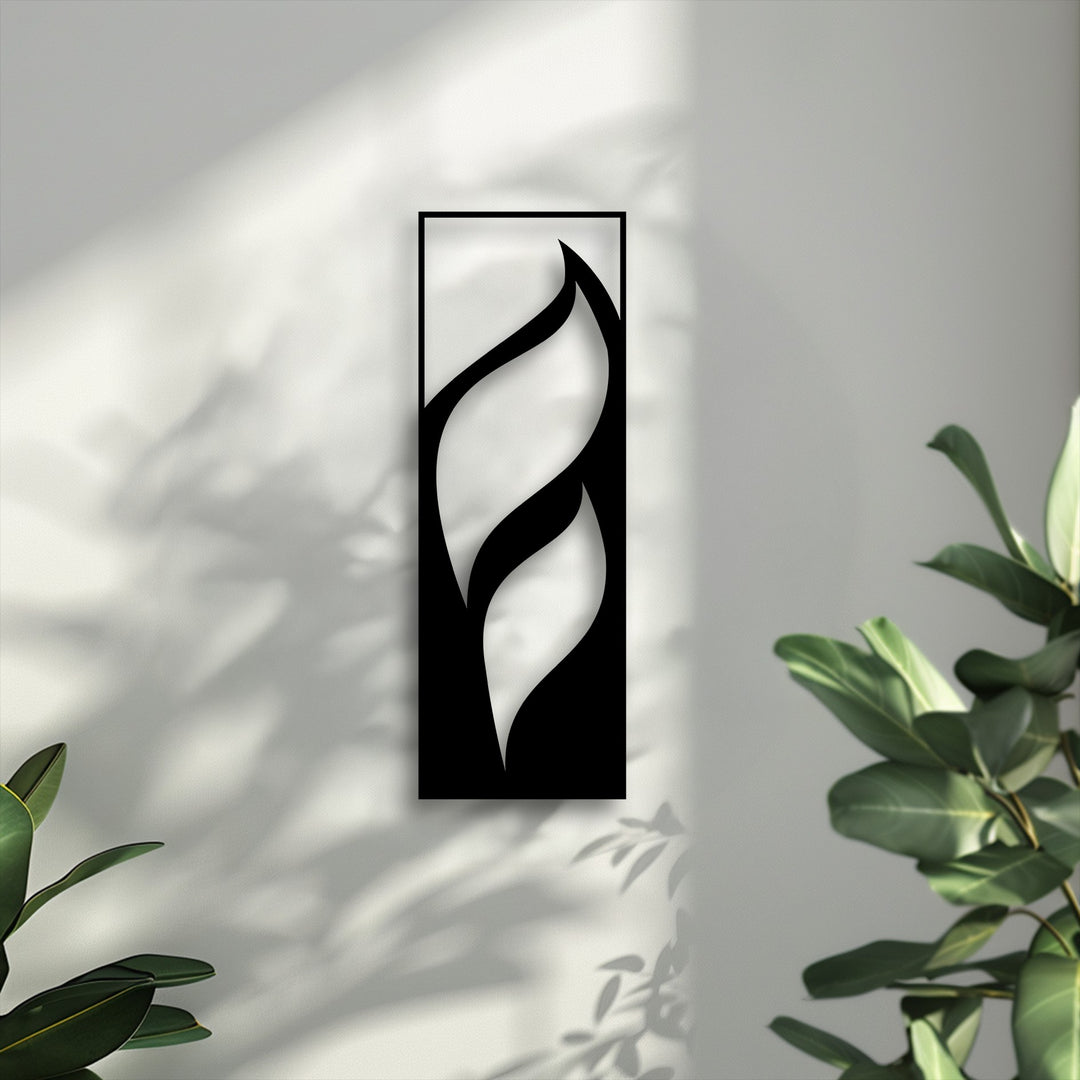 Multiple layers of light and shadow create striking depth around the elegant flowing leaves metal wall decor on a textured white wall.