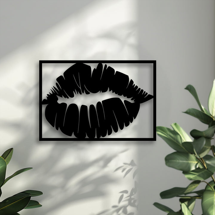 The focal point is a striking black bold kiss silhouette metal art for wall, showcasing modern lips against a light wall.