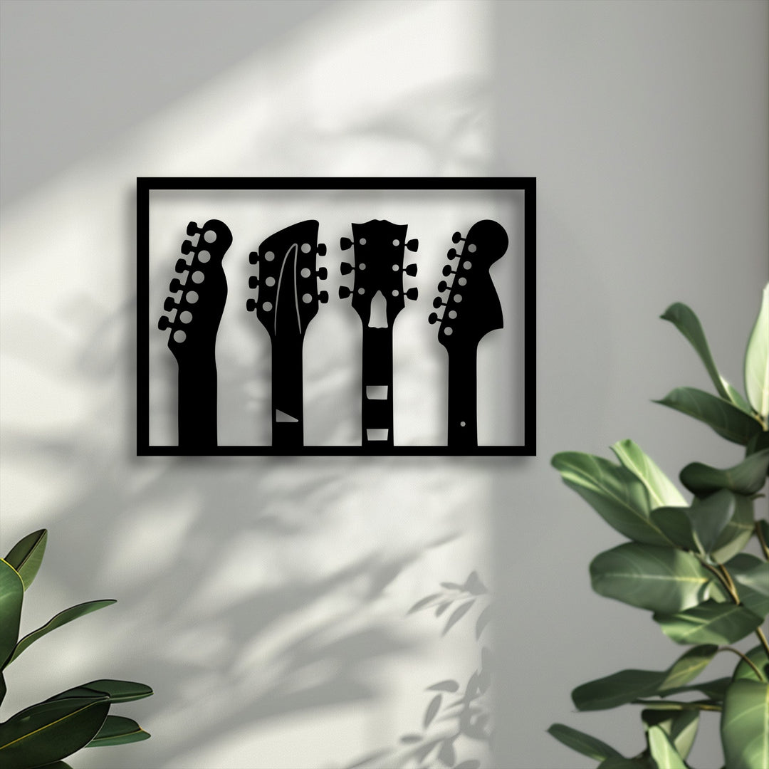The bright white wall, adorned with soft, leafy shadows, showcases the artistic guitar headstock silhouettes metal wall decor.