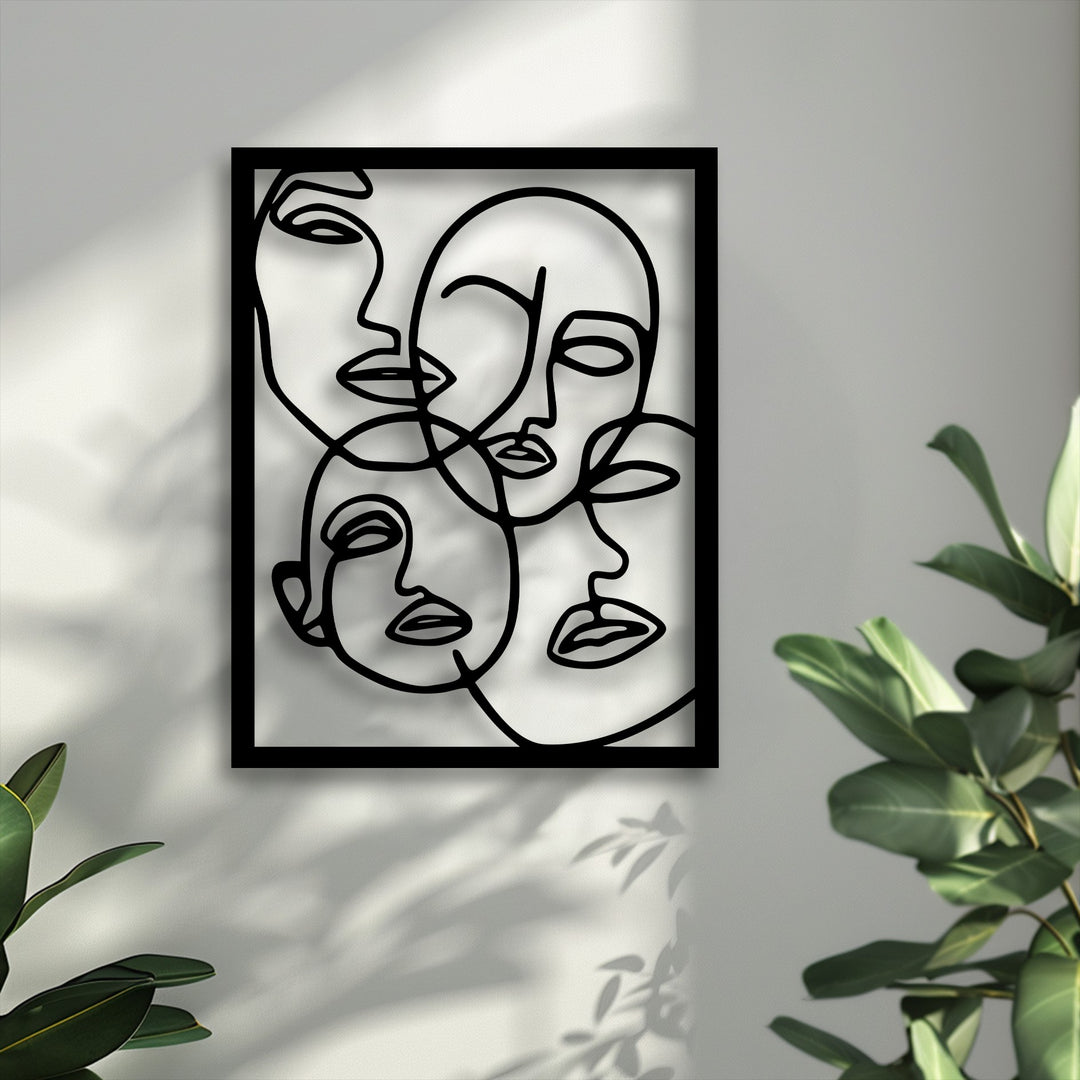 Abstract and modern, this minimalist line art metal decoration wall art features intertwined faces, casting intriguing shadows on a textured wall.
