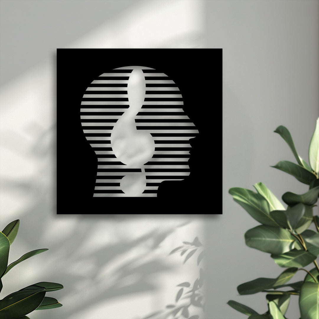 The layered design of this abstract face metal artwork reveals a striking human profile with horizontal stripes and a fluid white musical note form, creating depth.