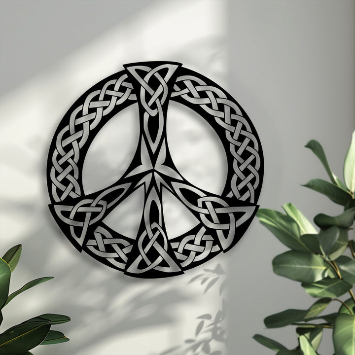 The negative space intricately defines the striking Celtic Knot Peace Symbol, forming a captivating piece of decorative metal art.