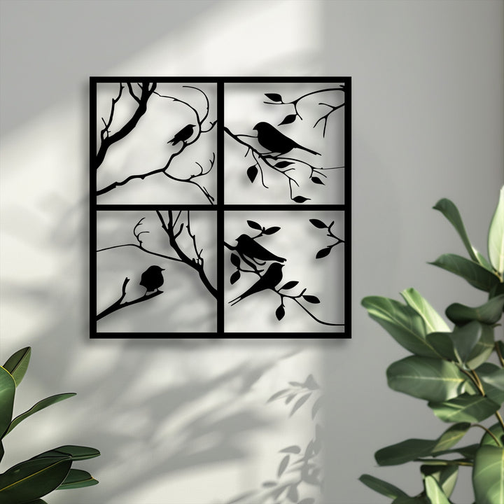 This decorative metal art bird panel creates depth and layers, standing off the wall, casting shadows, with a plant foreground.