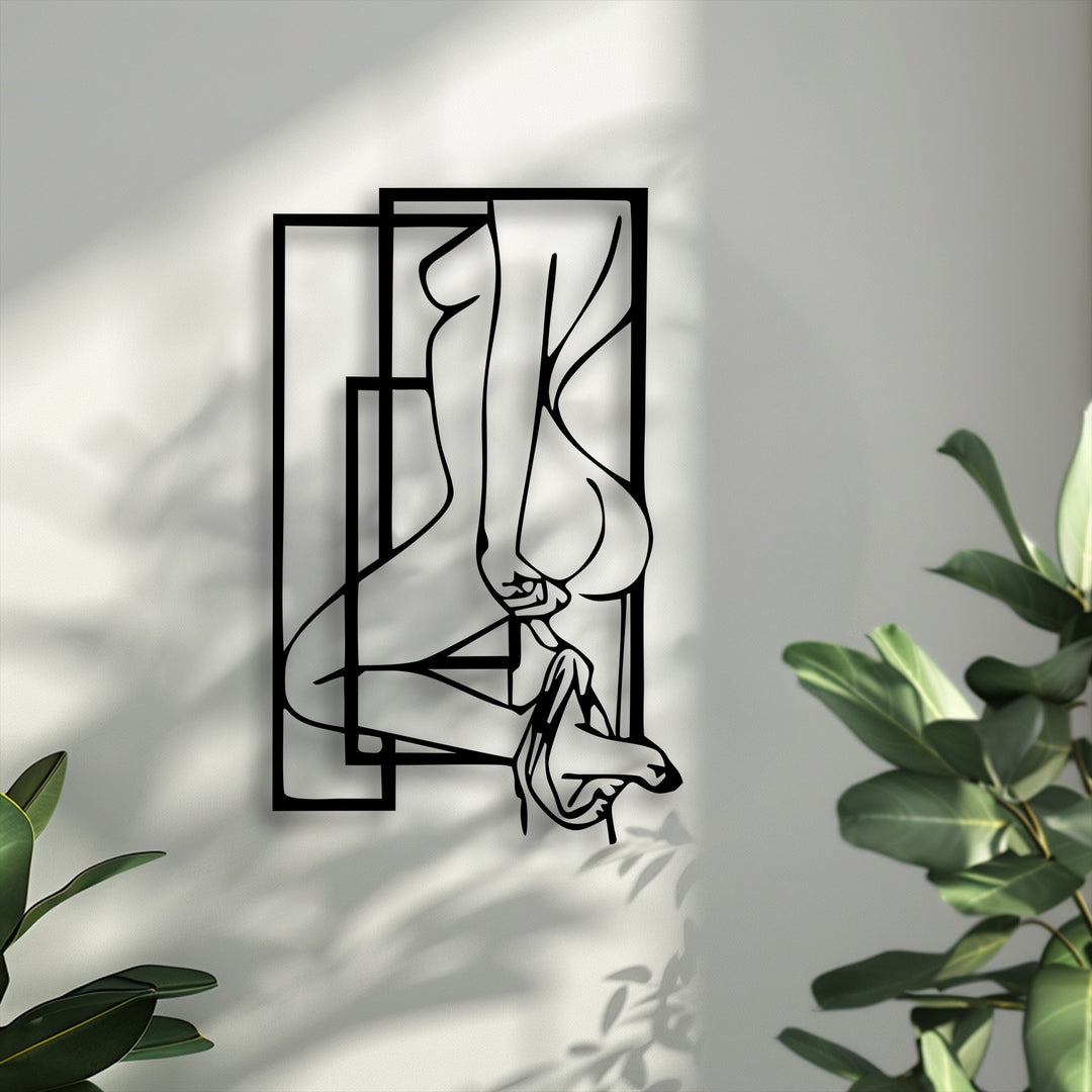 The realistic detail of this abstract feminine silhouette metal artwork features geometric frames and crisp shadows on the wall.