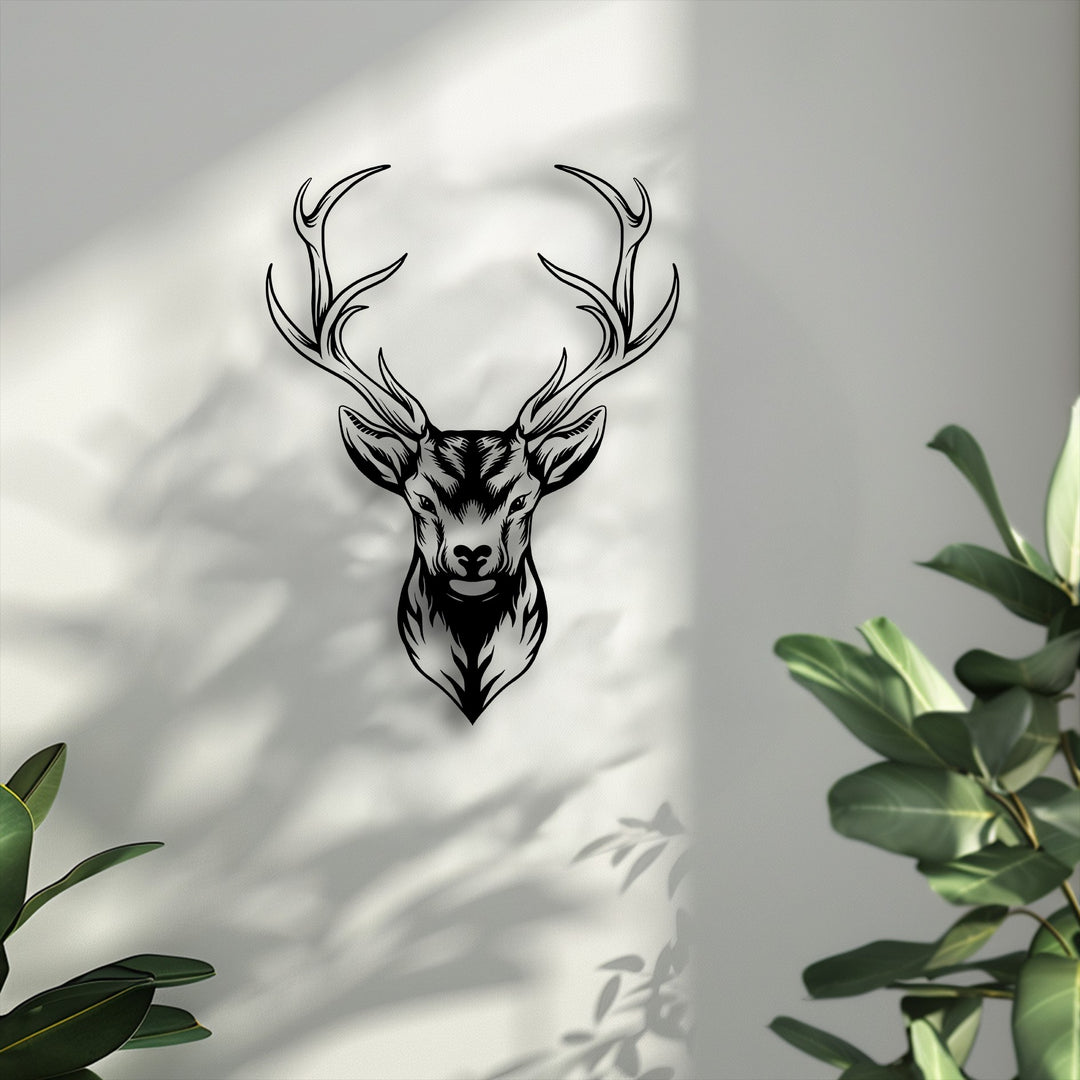 A striking vertical silhouette of a majestic deer head with intricate antler design, forming elegant metal art for wall decor.