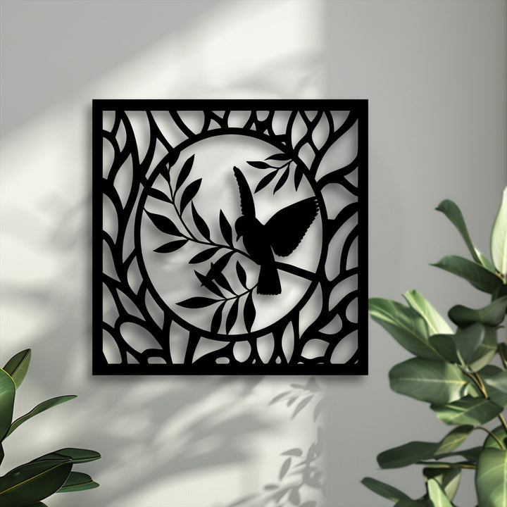The elegant bird metal decoration wall art features intricate layers, casting deep shadows that add dramatic depth to the pristine white wall.