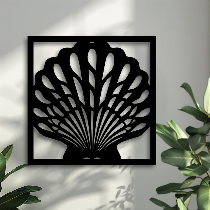 The geometric elements of this seashell metal art for wall reveal radiating lines and organic curves within a sleek square frame.