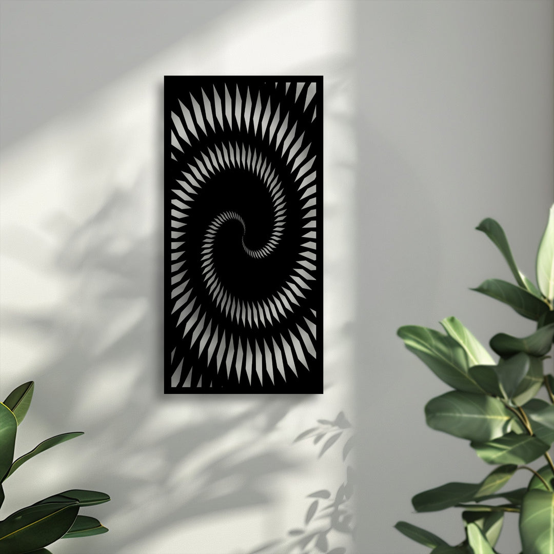 The multi-layered composition of the wall, dappled with shadowy plant details, frames the hypnotic spiral decorative metal art, adding visual depth.
