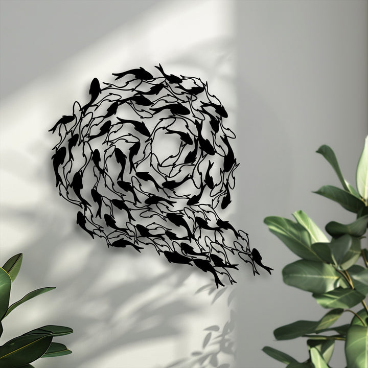 The visual rhythm of black koi fish decorative metal art, arranged in a swirling circle, creates dynamic flowing harmony on the light wall.
