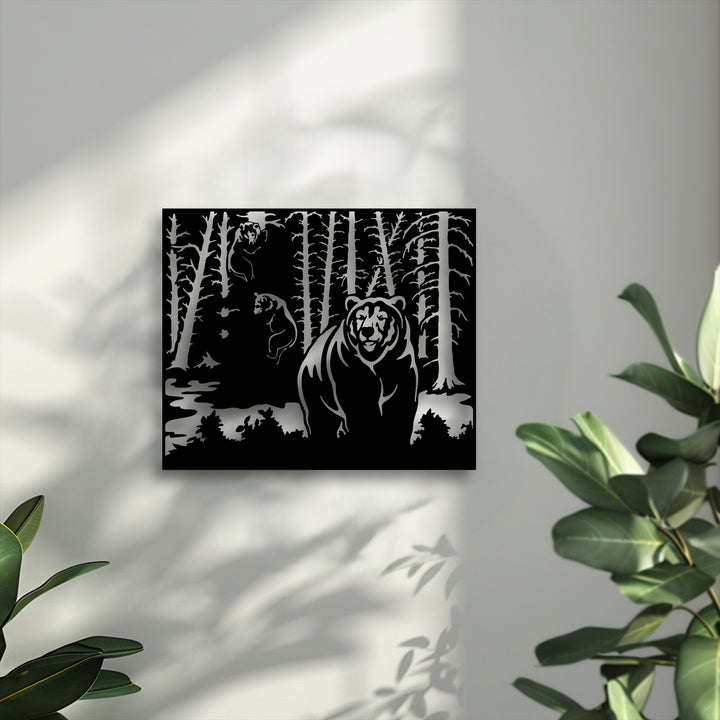 The distinct color transition from the bold black wild forest bear metal artwork to the bright grey wall and lush green foliage.