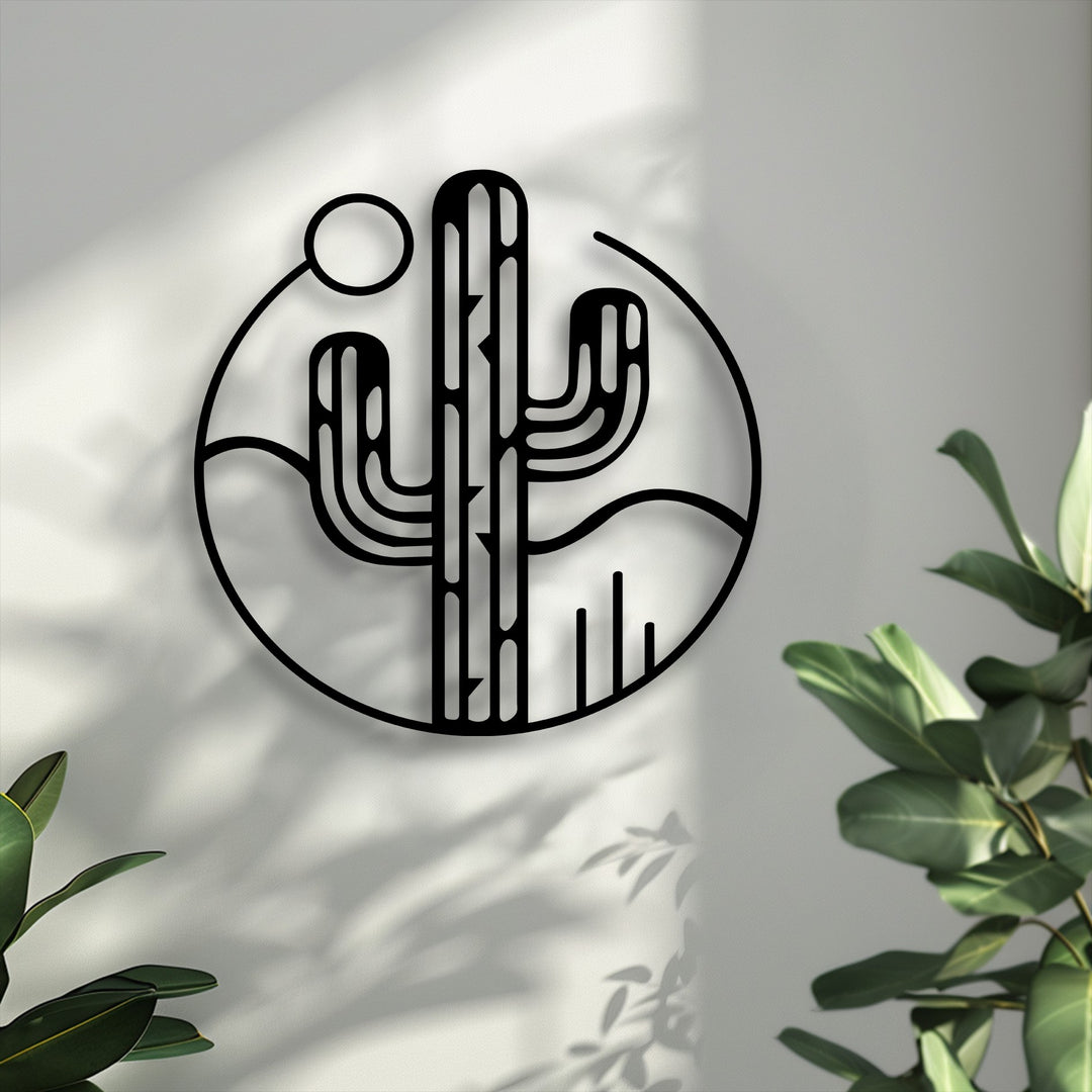 The stark color contrast highlights this minimal desert cactus decorative metal art, featuring a bold black design against a light wall with vibrant green plants.