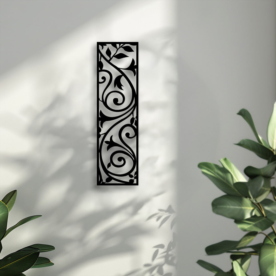 Depth and layers are created by the scroll vine metal artwork, casting shadows on the wall, enhanced by nearby foliage.