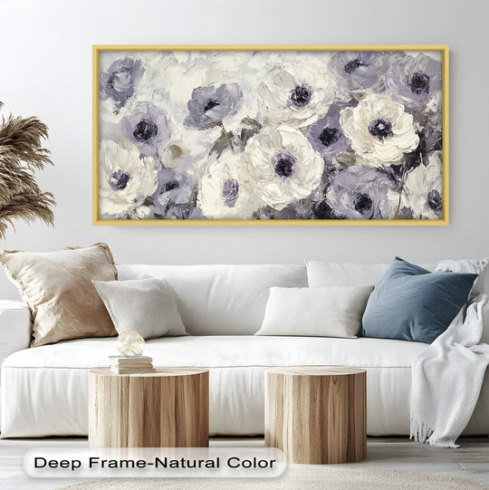 Highlighting the background, the off-white wall complements the framed oil painting artwork of cream and lilac petals, enhancing the serene and elegant floral composition.