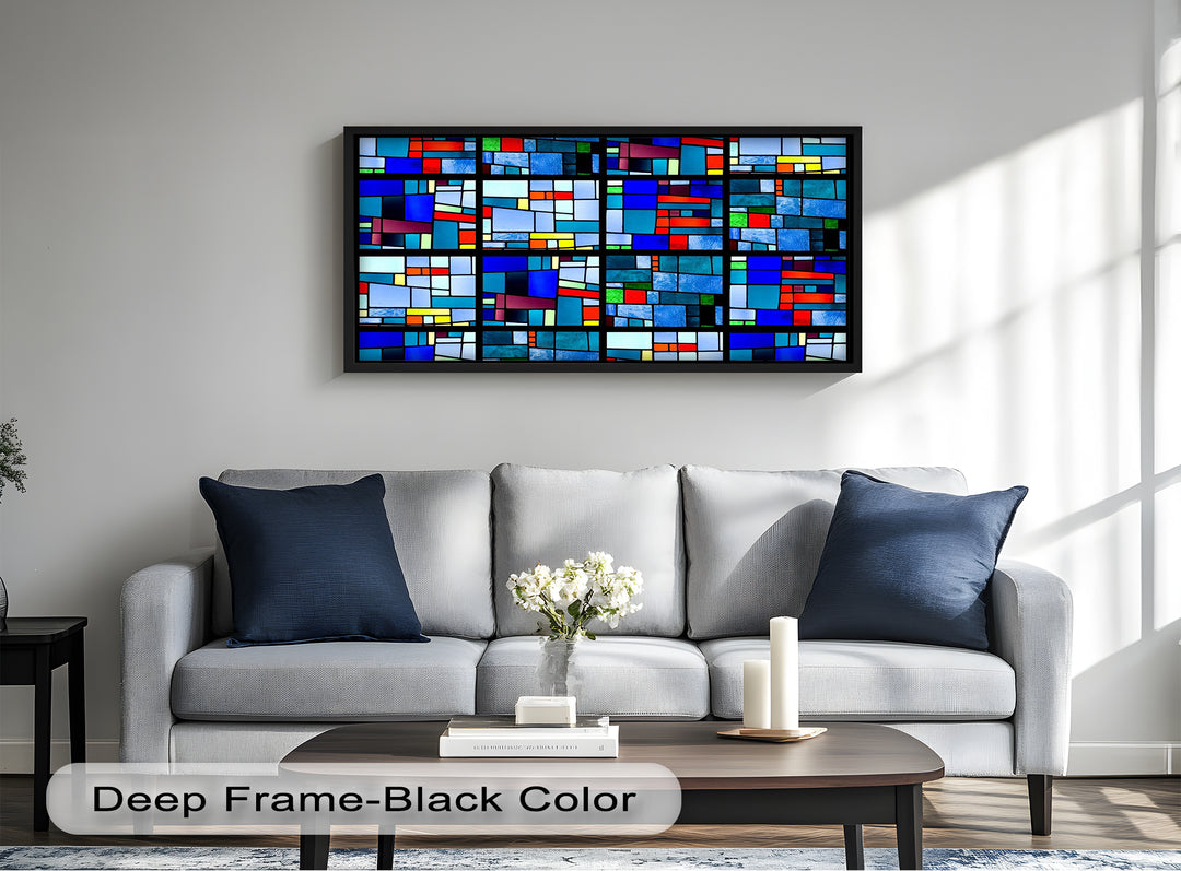 A colorful abstract wood panel with intersecting shapes and jewel-toned glass pieces outlined in black.