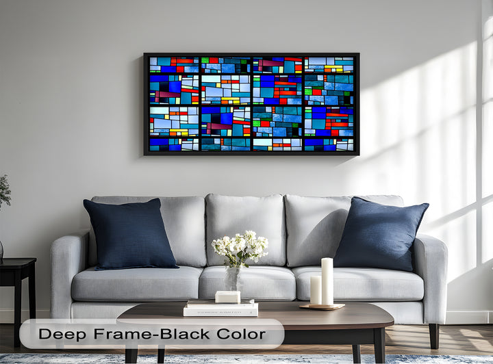 A colorful abstract wood panel with intersecting shapes and jewel-toned glass pieces outlined in black.