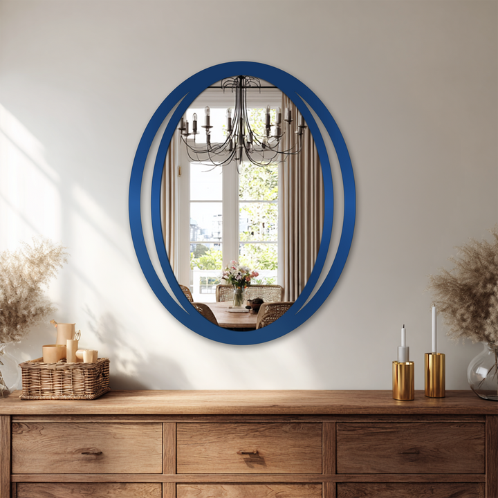 Echoing the sense of movement, the sleek, double oval frame of this modern mirror seems to orbit, adding subtle energy as a sophisticated home decoration.