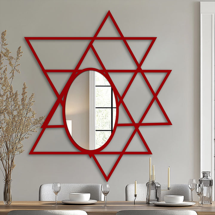 Visual rhythm emanates from the intersecting triangles forming this geometric oval floor mirror, a piece of metal artwork creating dynamic patterns in any interior.