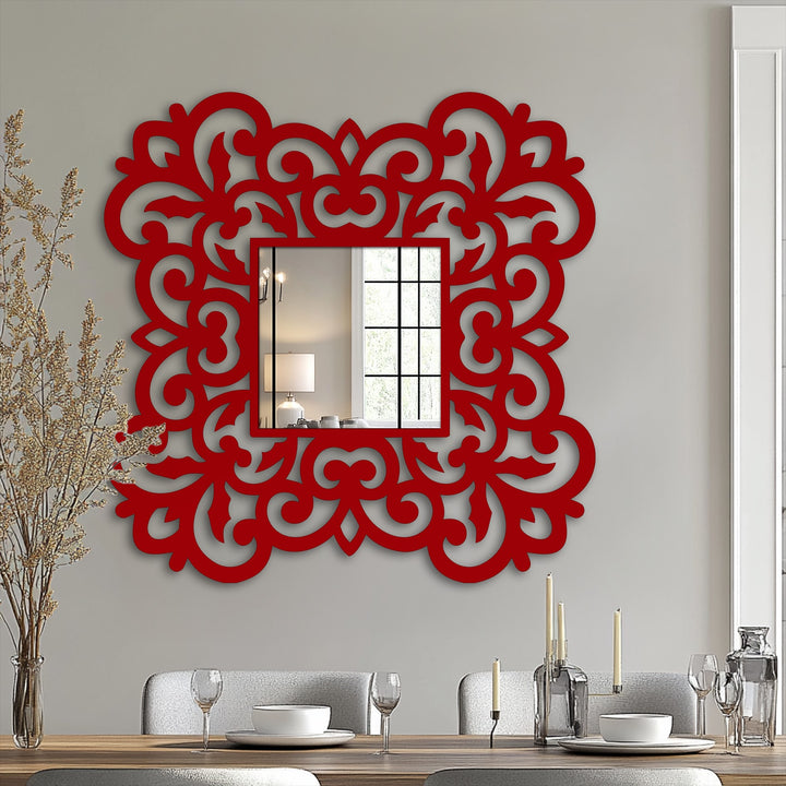 The stillness of the ornate floral scroll frame defines this decorative, square framed wall mirror, reflecting light and adding a touch of elegance with its metal detail.