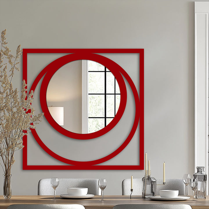 Warm color temperature accentuates the reflective qualities of this Eclipse square mirror for wall decor, framed by a bold red geometric metal artwork design.