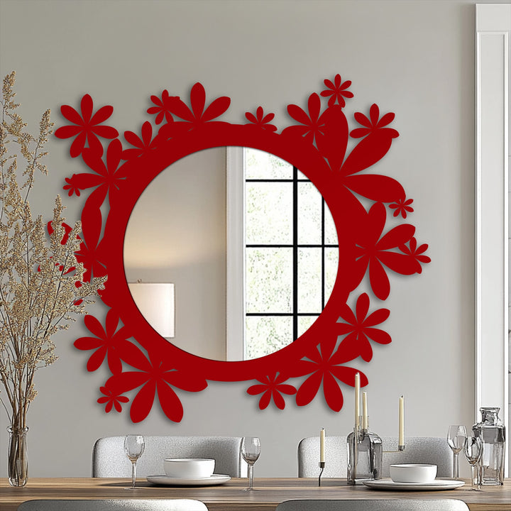A dramatic transition in hues enhances the red floral frame of this stylish Bloom Halo framed wall mirror, reflected in its circular design and black metal decor.