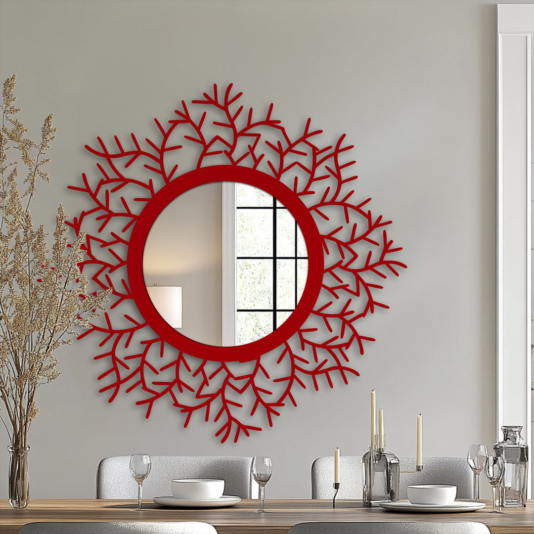 The neutral background highlights a botanical halo framed wall mirror, showcasing a decorative metal art leaf design around a round center mirror.