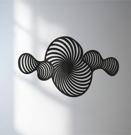 Black decorative metal art dominates this abstract spiral wall sculpture, creating a modern geometric design.
