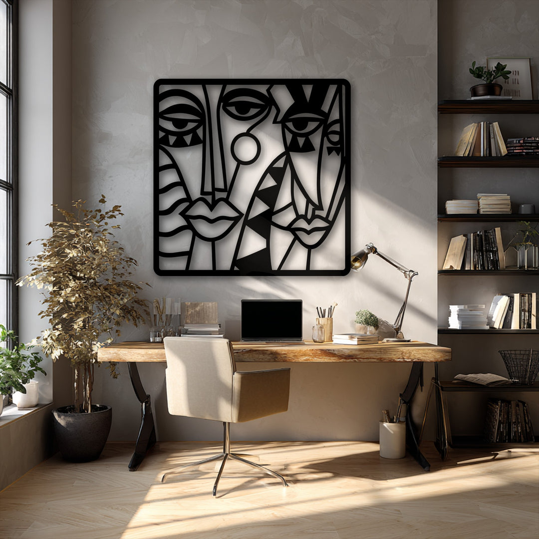 A sophisticated and artistic mood permeates this modern workspace, highlighted by the striking abstract faces metal artwork.